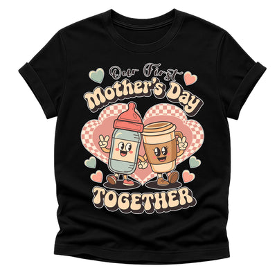 Black t-shirt with cartoon milk and coffee characters and 'Our First Mother's Day Together' text on a white background