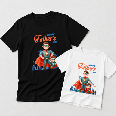 Two Father's Day graphic T-shirts shown on a light gray background: a black adult-sized shirt and a white child-sized shirt, both featuring a colorful superhero illustration and the text 'Happy Father's Day'.
