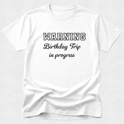 White t-shirt with 'WARNING Birthday Trip in progress' text on a white background