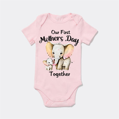 Pink baby onesie with elephant design and text on a white background