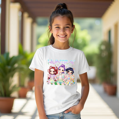 Young girl wearing a white t-shirt with colorful character kpop and easter design outdoors.