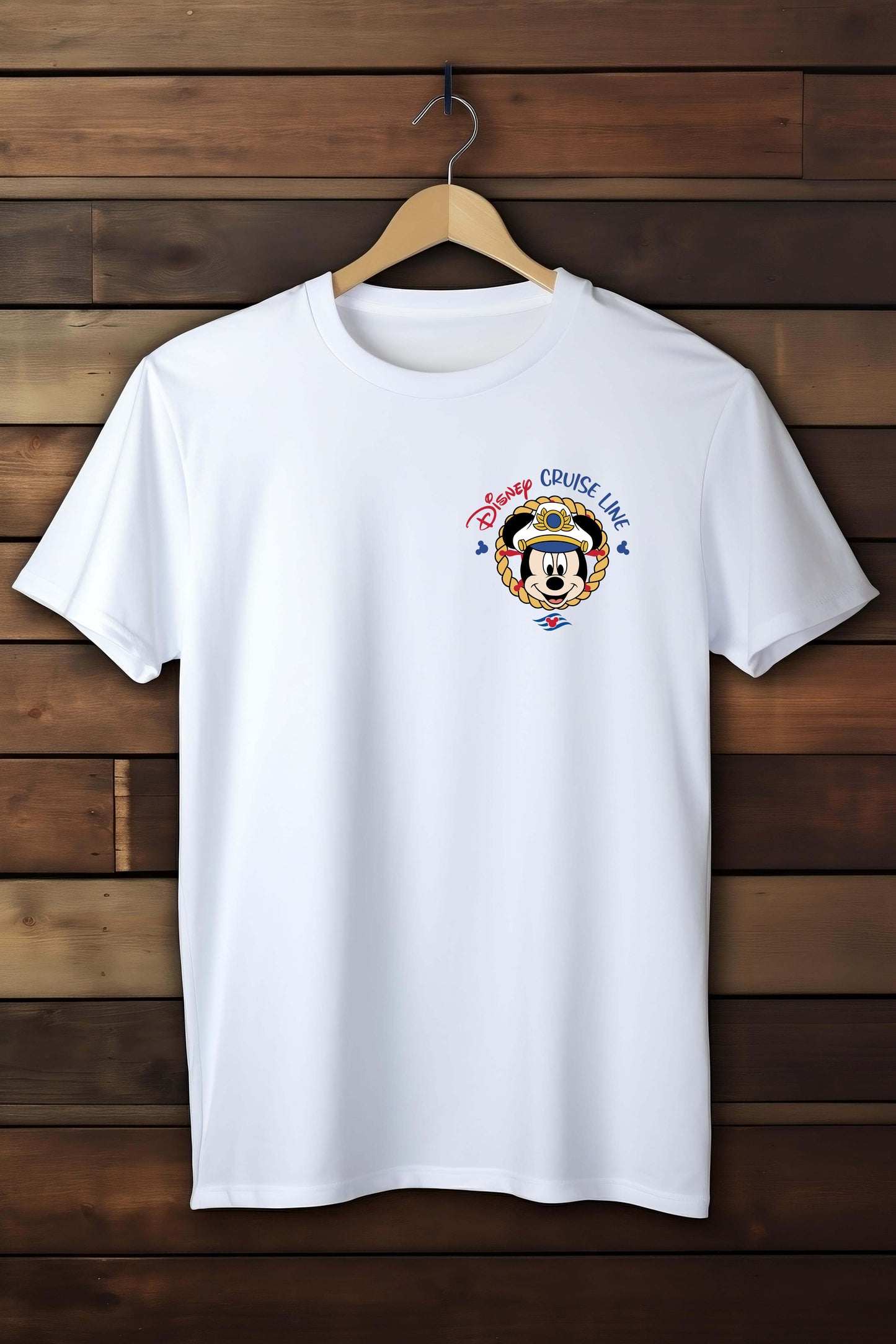White t-shirt with a Disney Cruise Line logo on a wooden background