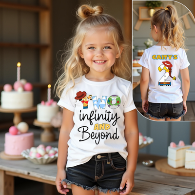 Child wearing a white t-shirt with 'Two Infinity and Beyond' design, standing in front of a table with birthday cakes.