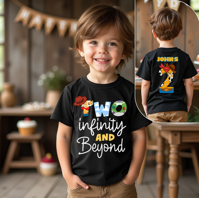 Child wearing a black t-shirt with colorful text and graphics, standing in a room with wooden furniture.