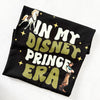 In My Prince Flynn Era Disney-inspired t-shirt displayed flat on black shirt