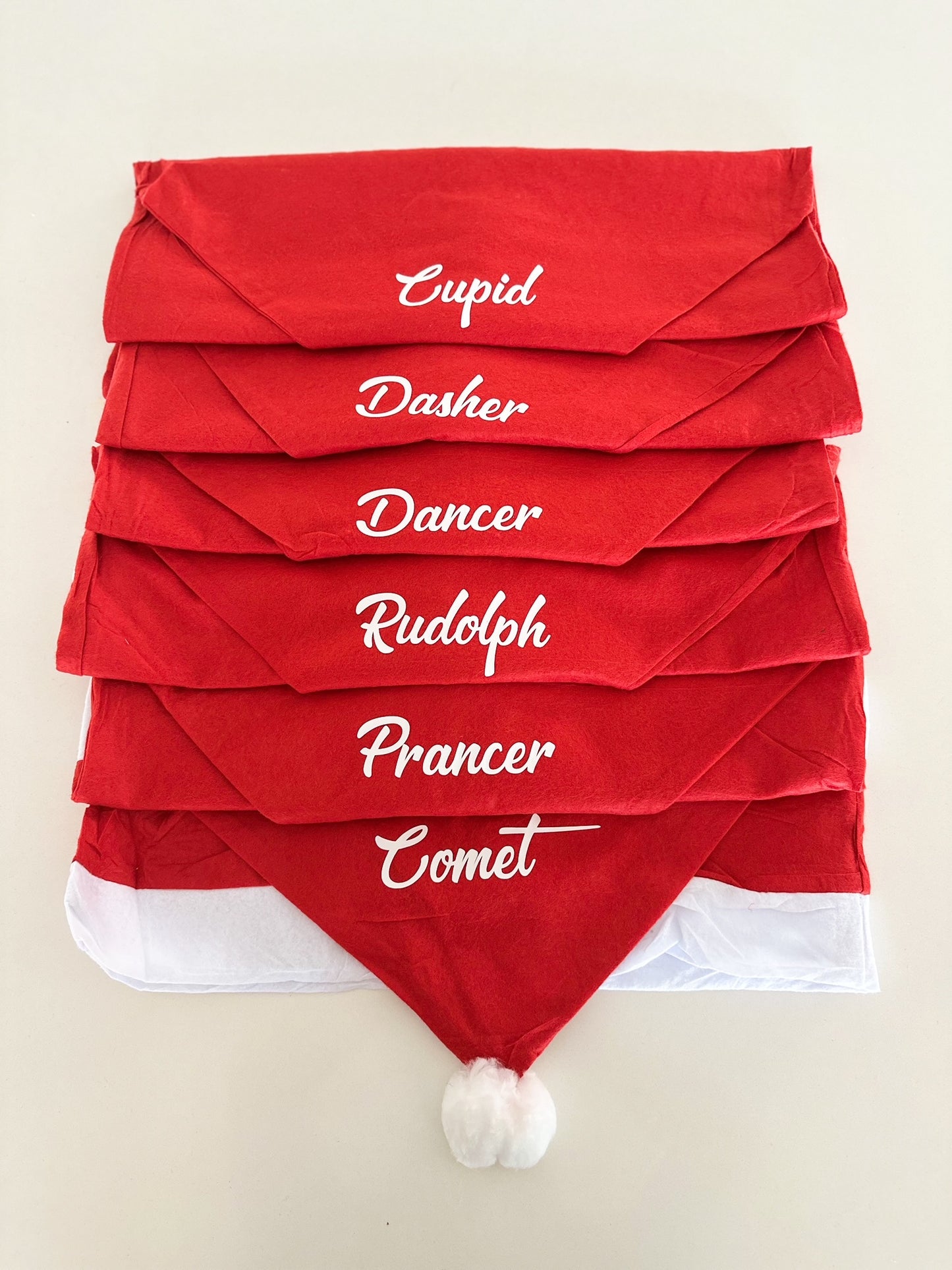 Festive red and white chair cover set for Christmas table setting