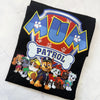 Black blanket with 'Mum Patrol' text and cartoon characters on a white background