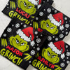 Personalised festive Grinch t-shirt with custom text under design