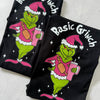 Close-up of Basic Grinch Pink Christmas Tshirt – playful holiday design with pink cross-over bag