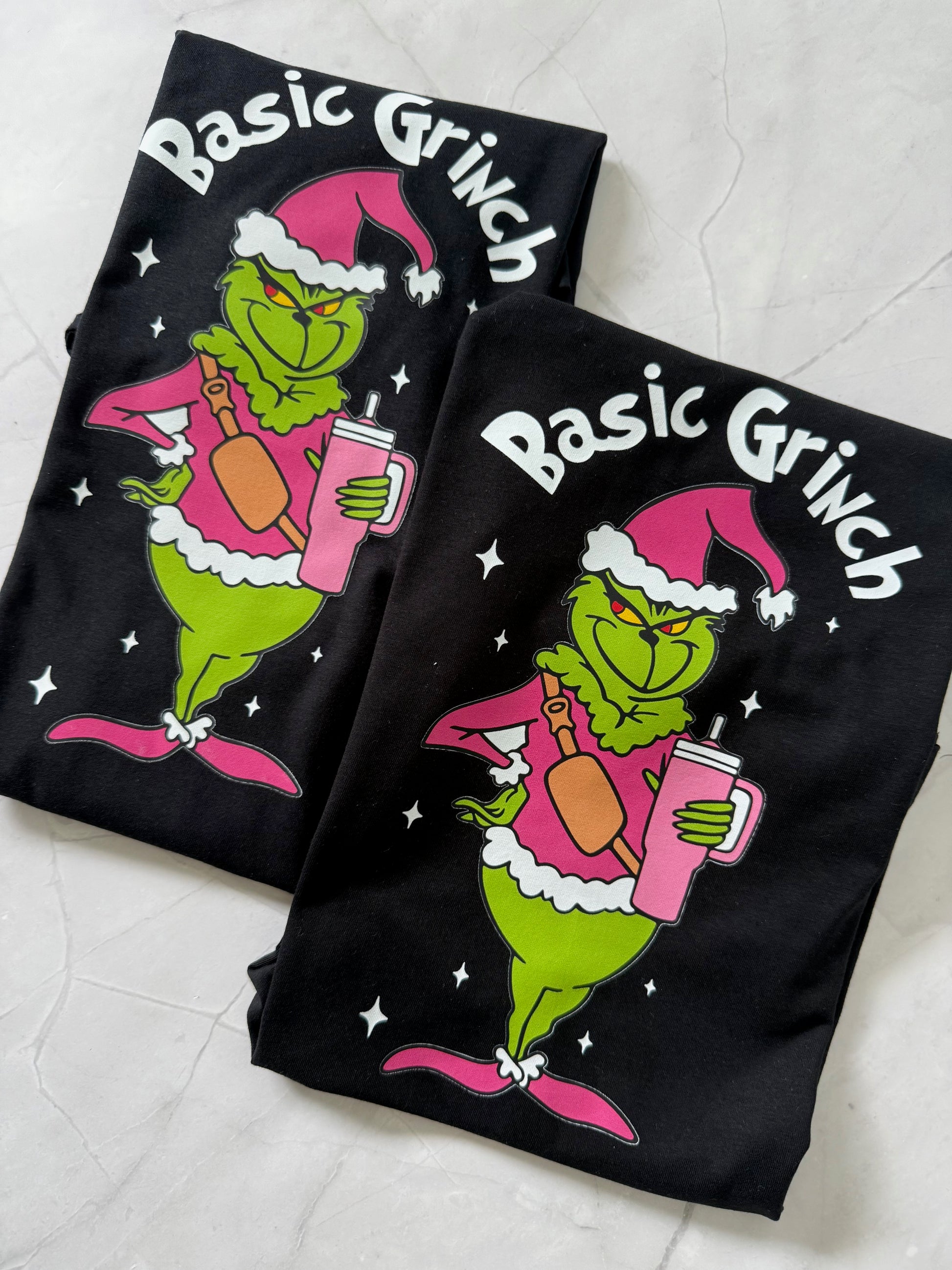 Close-up of Basic Grinch Pink Christmas Tshirt – playful holiday design with pink cross-over bag