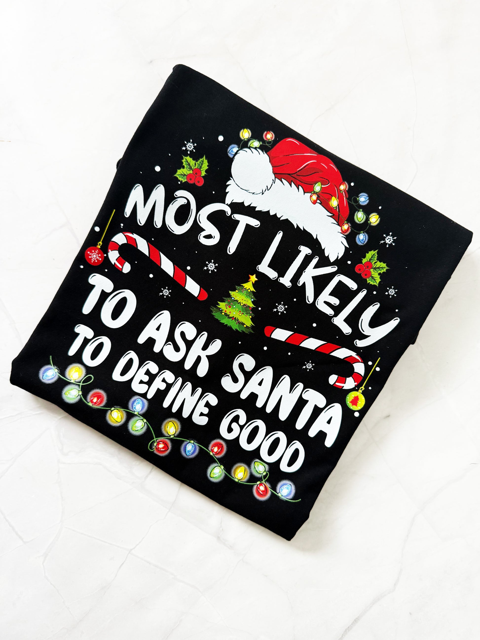 Humorous holiday tee with cheeky Santa quote design
