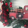 Custom holiday door wreath with festive red and green design