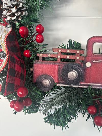 Custom holiday door wreath with festive red and green design