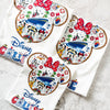 Set of three Disney-themed coasters on a white surface