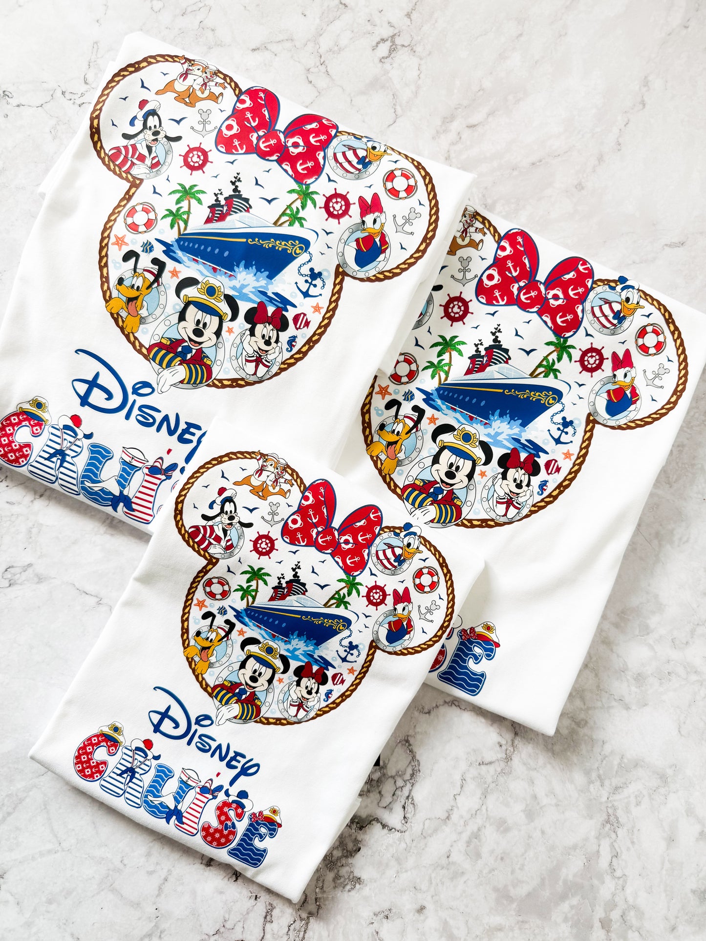 Set of three Disney-themed coasters on a white surface