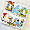 Two tshirts with toy story cartoon characters and colorful text on a textured white surface.