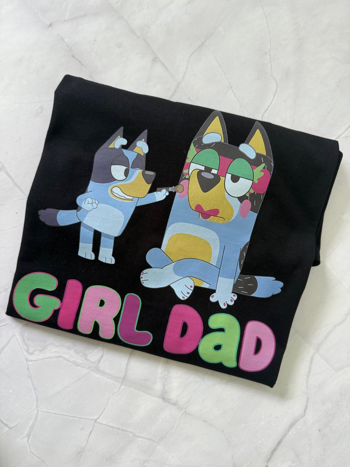 Flat lay of Girl Dad Style tee 