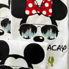 T-shirt with Minnie Mouse design, sunglasses with castle reflection, and 'VACAY' text.