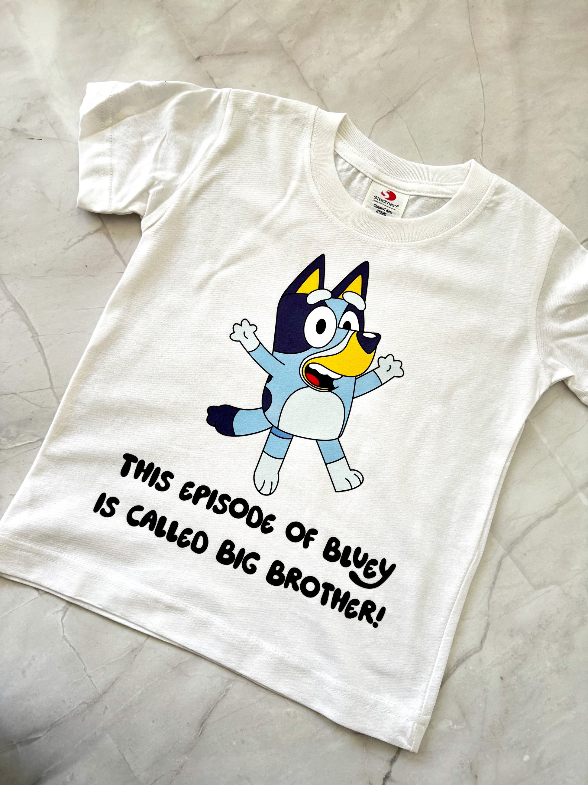 Bluey-themed shirt with Bandit-inspired character and customizable name underneath.