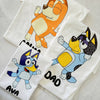 Flat lay showing different t-shirt color options with Bluey-inspired character graphics from Set 1.