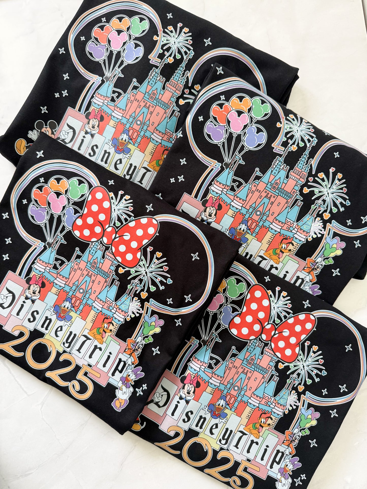 Detailed close-up of Classic Magical Kingdom t-shirt print, featuring castle and whimsical lettering.