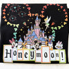 Close-up of romantic castle artwork and magical lettering on Disney-inspired honeymoon shirt

