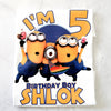 Minions birthday t-shirt folded with party decorations