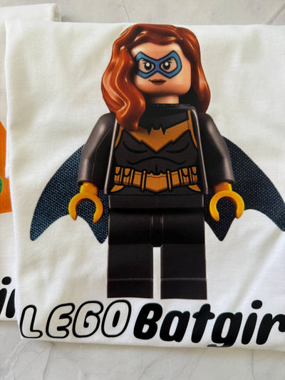 Close-up of colourful Lego superhero print on white kids t-shirt