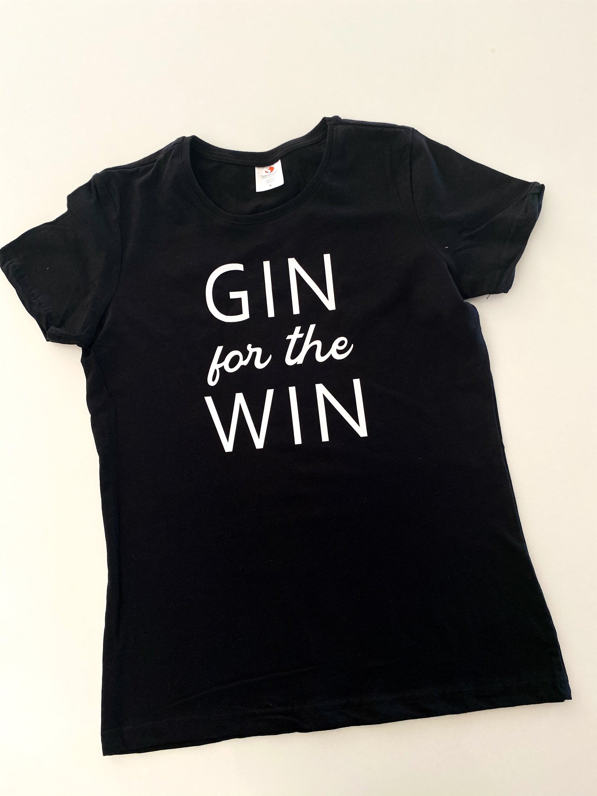 Close-up of custom text printed on white t-shirt
