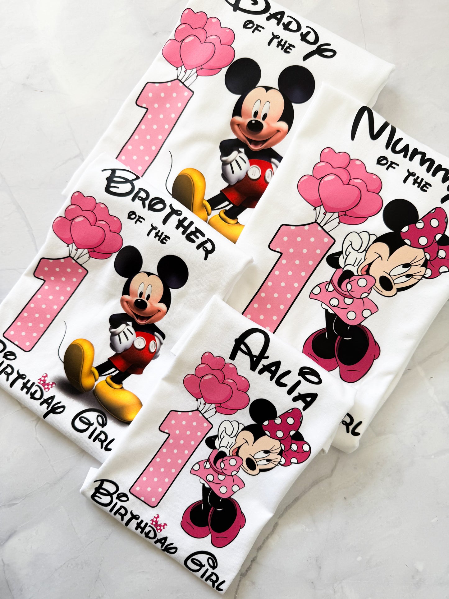 Close-up view of Disney inspired birthday shirt showing mouse ears and text graphic.