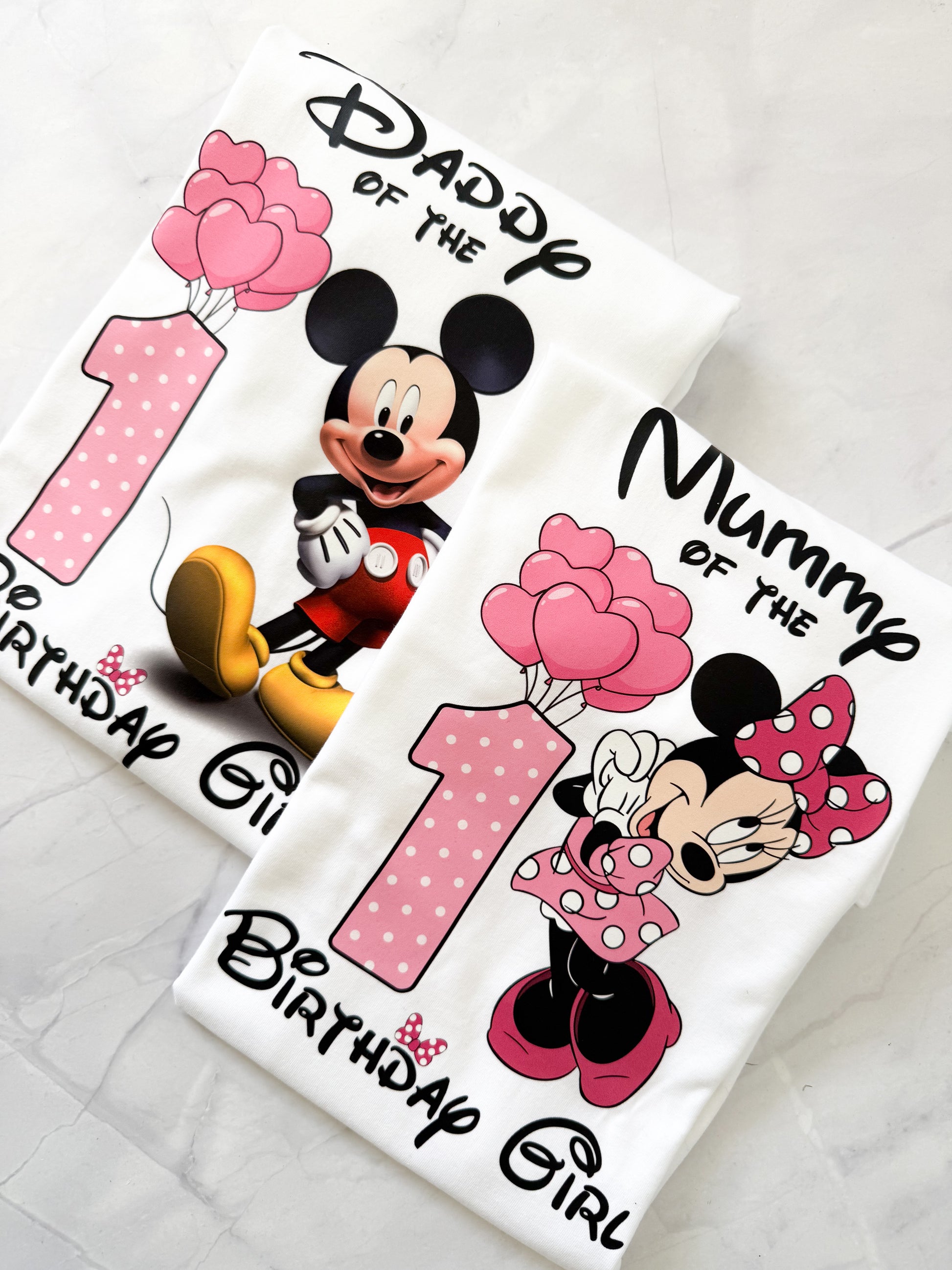 Family group wearing matching Mouse Birthday Collection t-shirts, perfect for party photos.