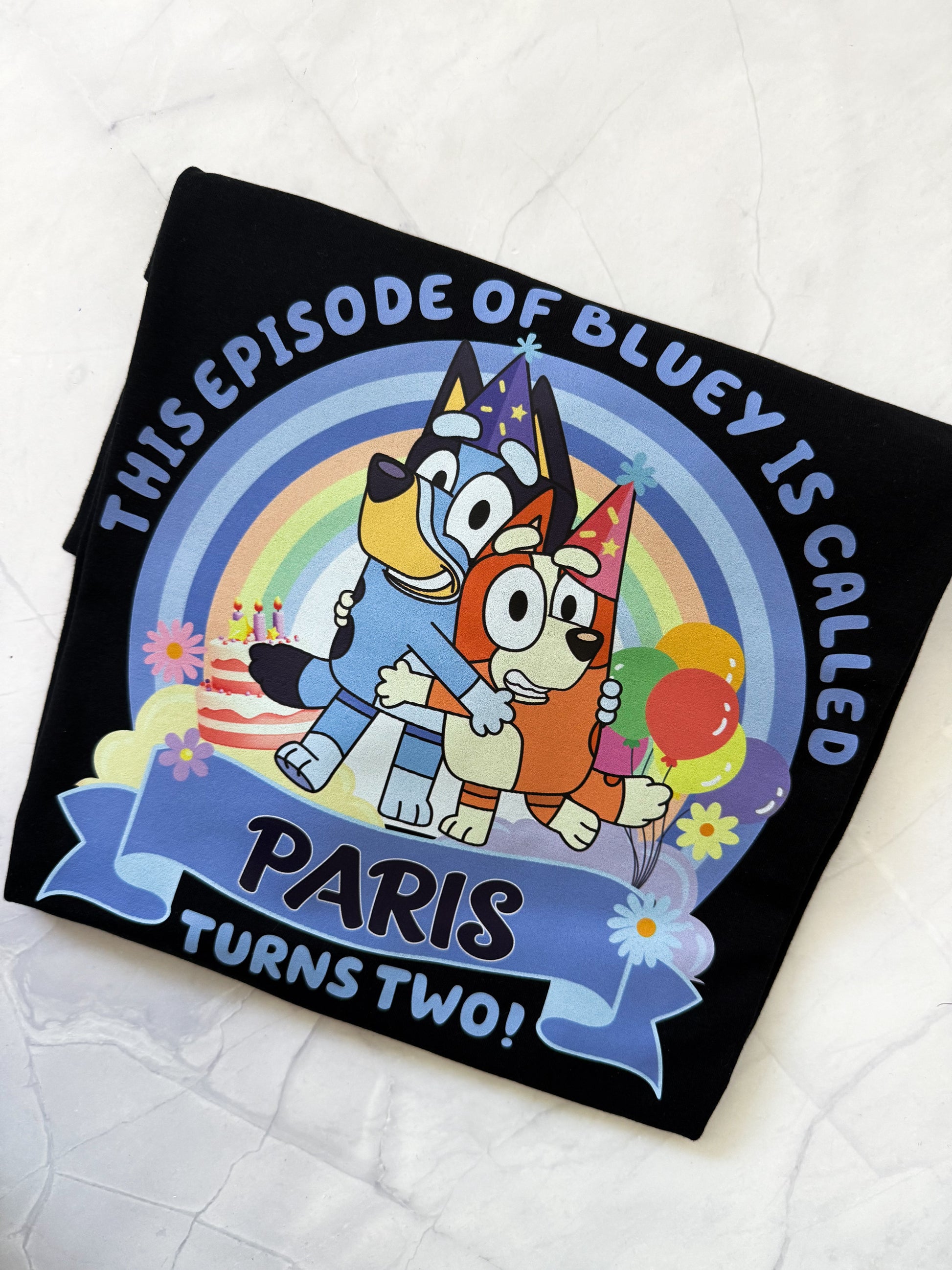Personalized tshirt with cartoon characters and text on a white background