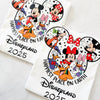 Happiest Place on Earth t-shirt with Disney-style design, laid flat on a neutral background.
