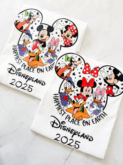 Happiest Place on Earth t-shirt with Disney-style design, laid flat on a neutral background.