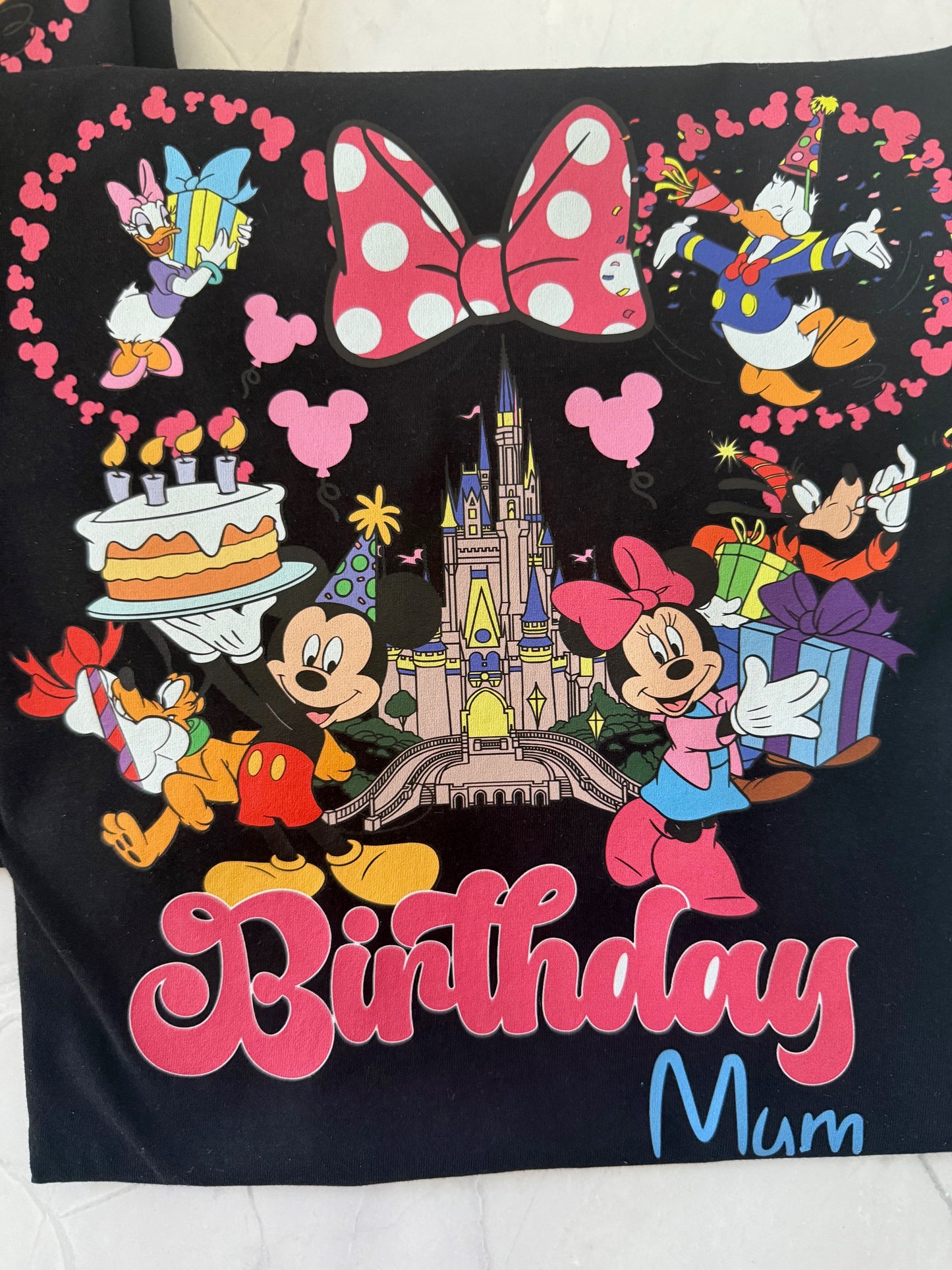Close-up of “Royal Birthday Gang” text and crown design on black t-shirt