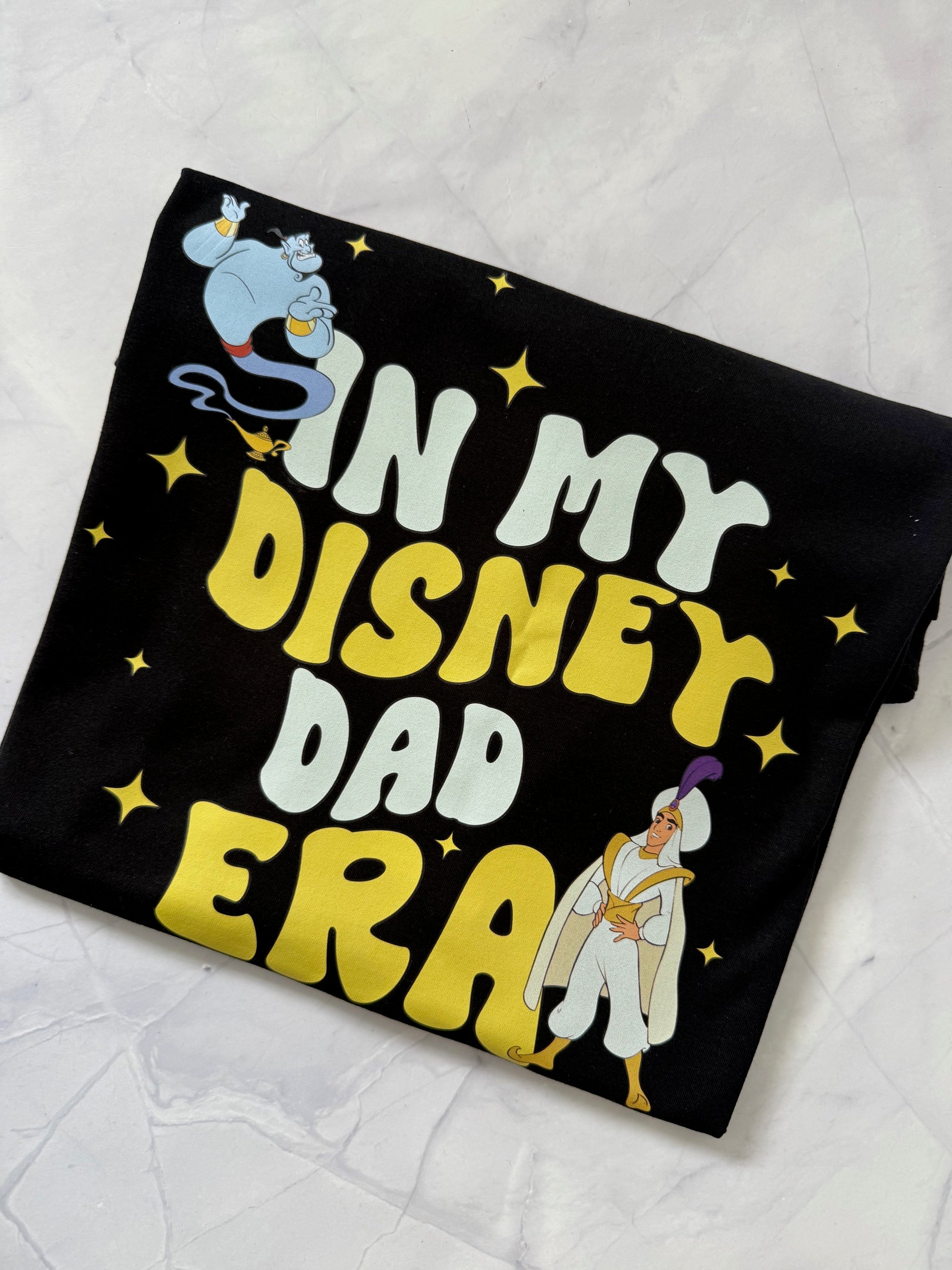 In My Prince Aladdin Era Disney-inspired t-shirt displayed flat on black shirt