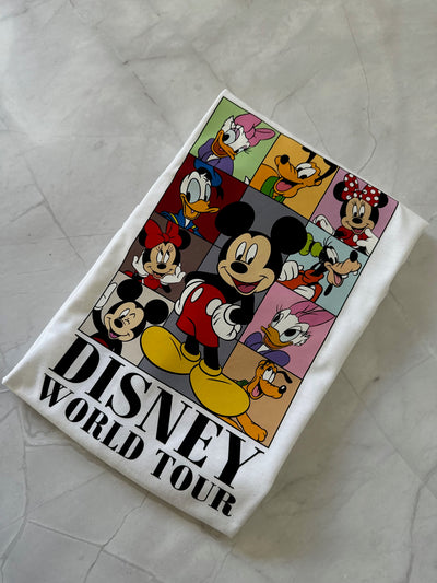 Towel with Disney characters and 'Disney World Tour' text on a textured surface