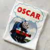 Close-up of personalised text on Thomas themed birthday shirt