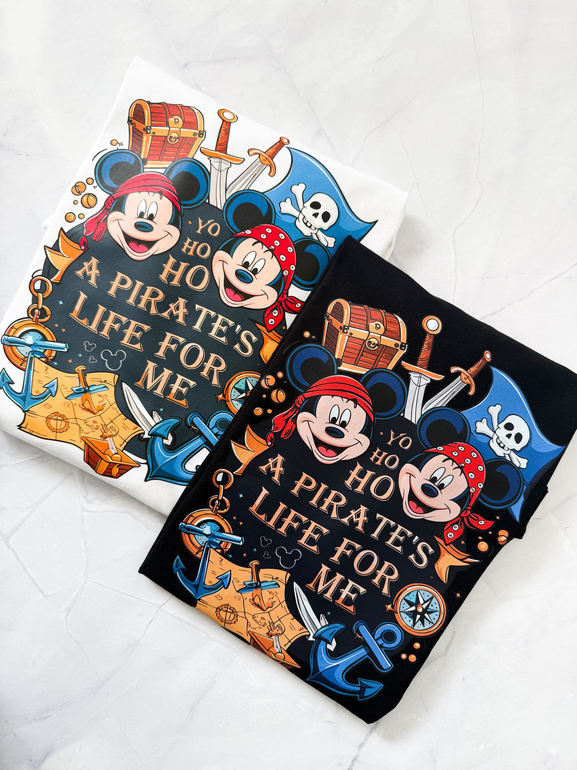 Disney cruise family matching pirate t-shirts laid flat