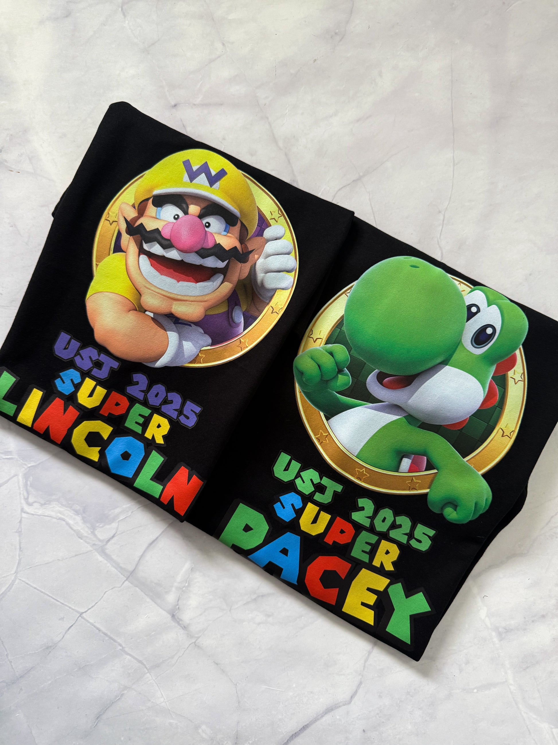 Kids flat lay Super Mario inspired birthday party t-shirts