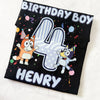 Black t-shirt with cartoon characters and 'Birthday Boy Henry' text on a white background