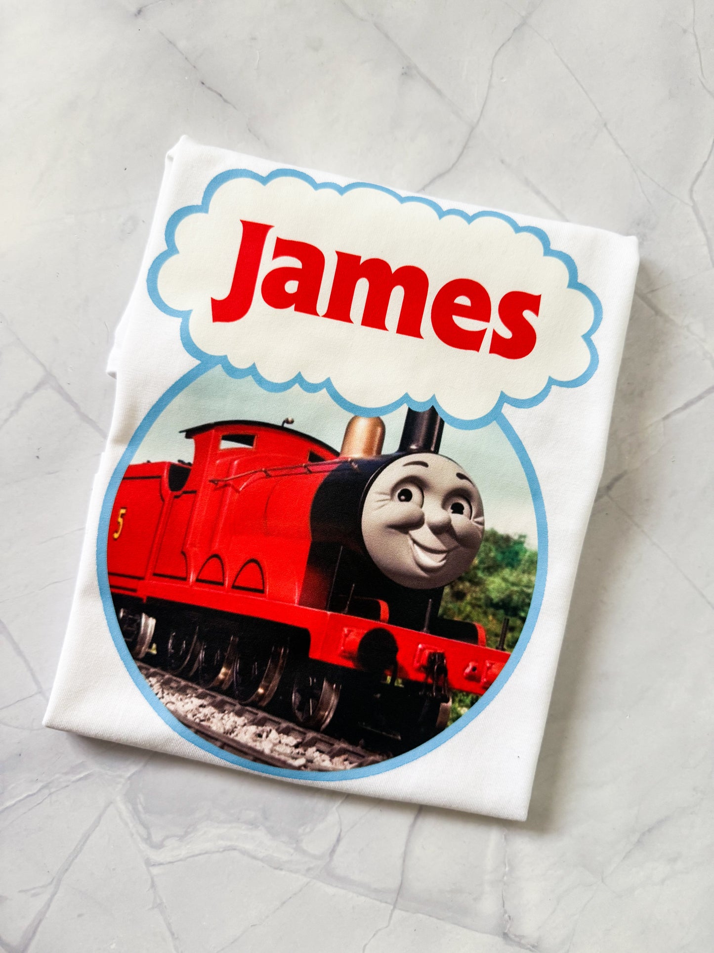 Toddler wearing a Thomas & Friends printed shirt, perfect for train fans
