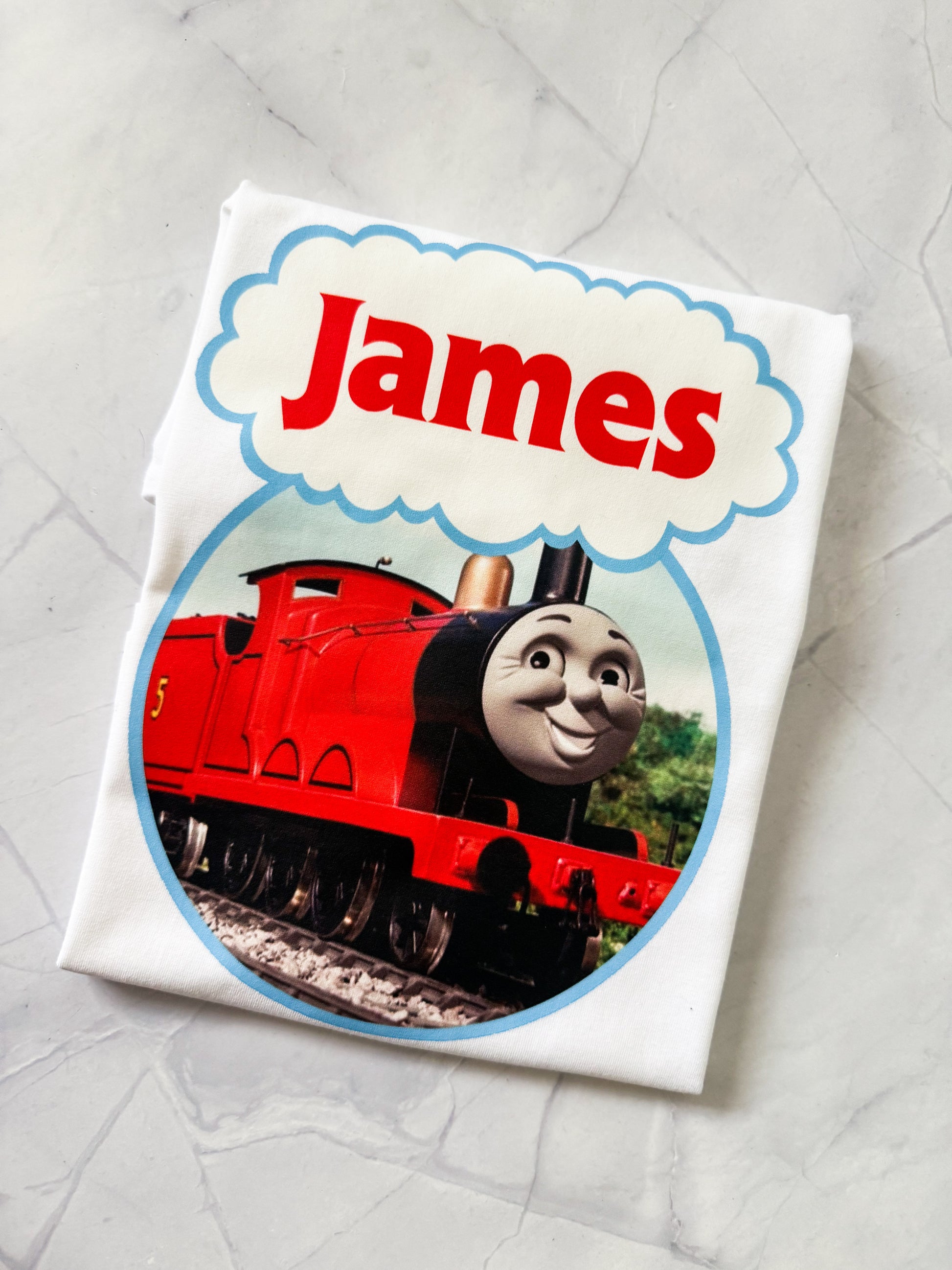 Toddler wearing a Thomas & Friends printed shirt, perfect for train fans