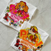 Two personalized PAW Patrol inspired birthday shirts – Skye and Rubble designs – folded on marble background.