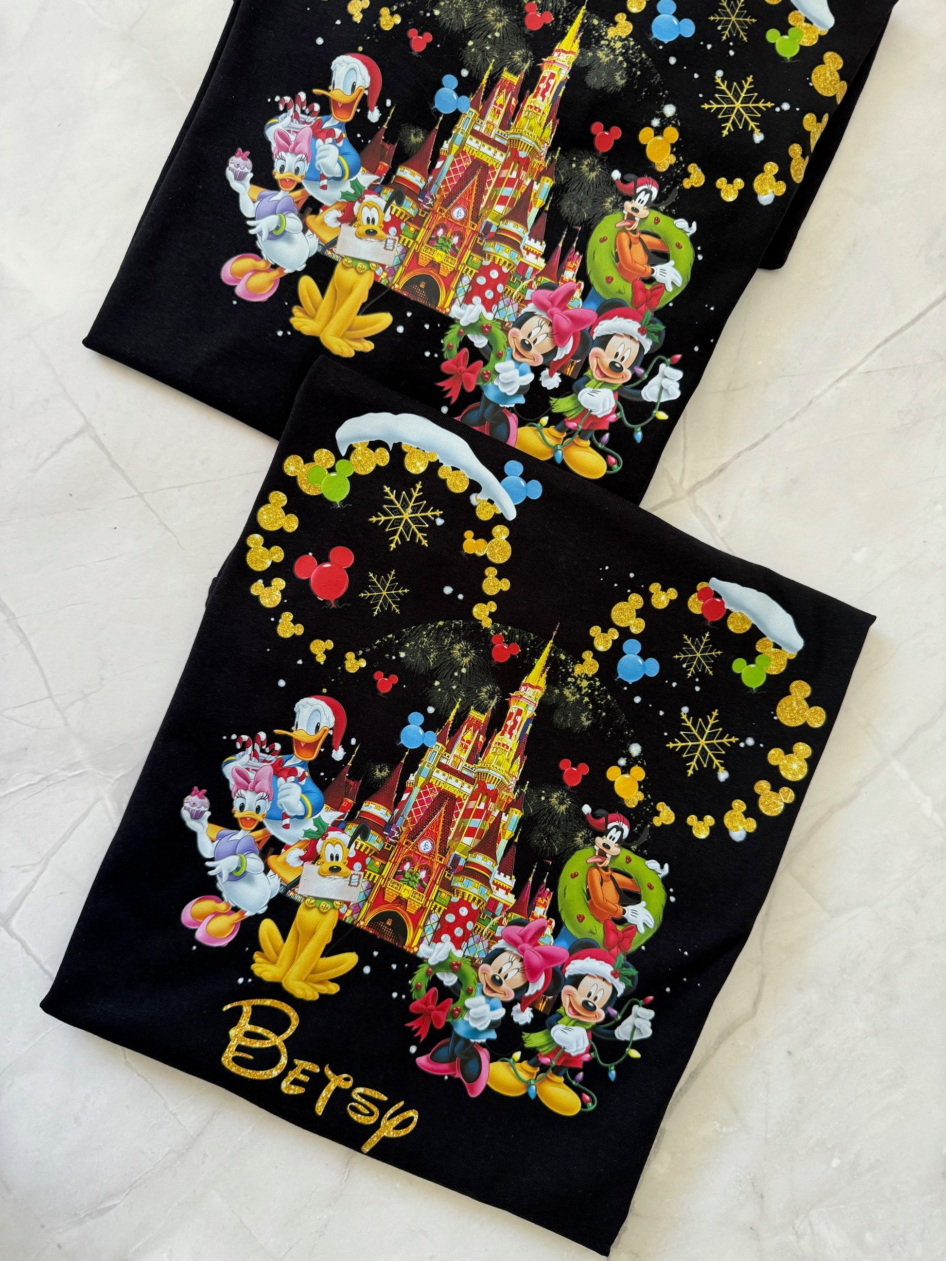 Holiday Disney t-shirt with all characters, snowflakes, and glitter gold Mickey ears design