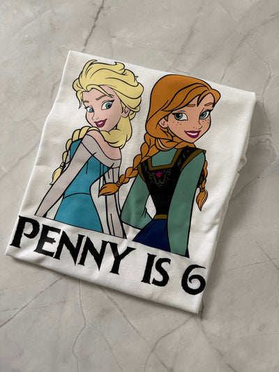 Close-up of Sister Magic T-Shirt highlighting detailed Elsa and Anna artwork and print quality