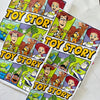  Flat lay of The Toy Box Crew family t-shirts featuring Toy Story-inspired design and playful colors.