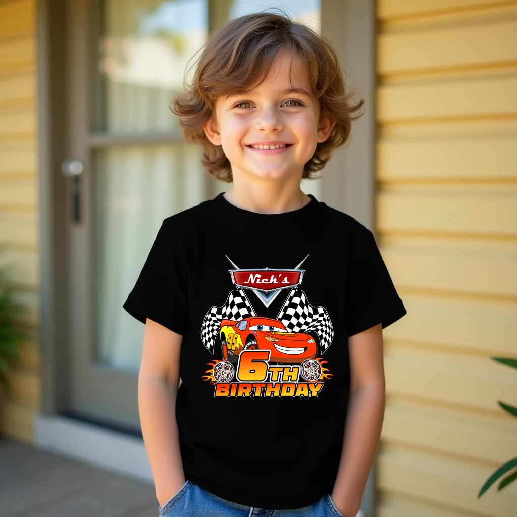 Child wearing a black t-shirt with a colorful design and text, standing outdoors.