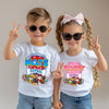 Two children wearing 'Nate Patrol' and 'Rachy Patrol' t-shirts with cartoon characters on a plain background.