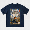 A navy blue short-sleeve t-shirt with a large graphic print on the front depicting a book cover for 'The Brave Knight' featuring a knight in armor and the text 'Starring Nate'.